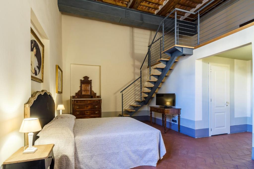 Postel nebo postele na pokoji v ubytování Dimora Storica Palazzo Puccini