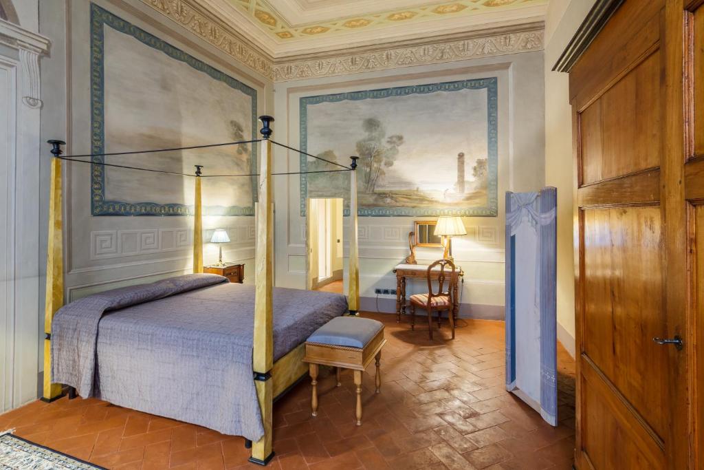 Postel nebo postele na pokoji v ubytování Dimora Storica Palazzo Puccini