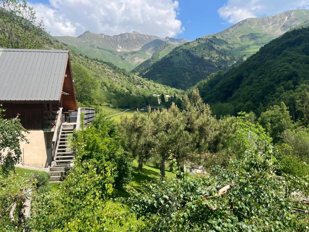 a house with a view of a valley with mountains at Chalet Vue Montagne 6 personnes proche Sanctuaire de La Salette in La Salette-Fallavaux