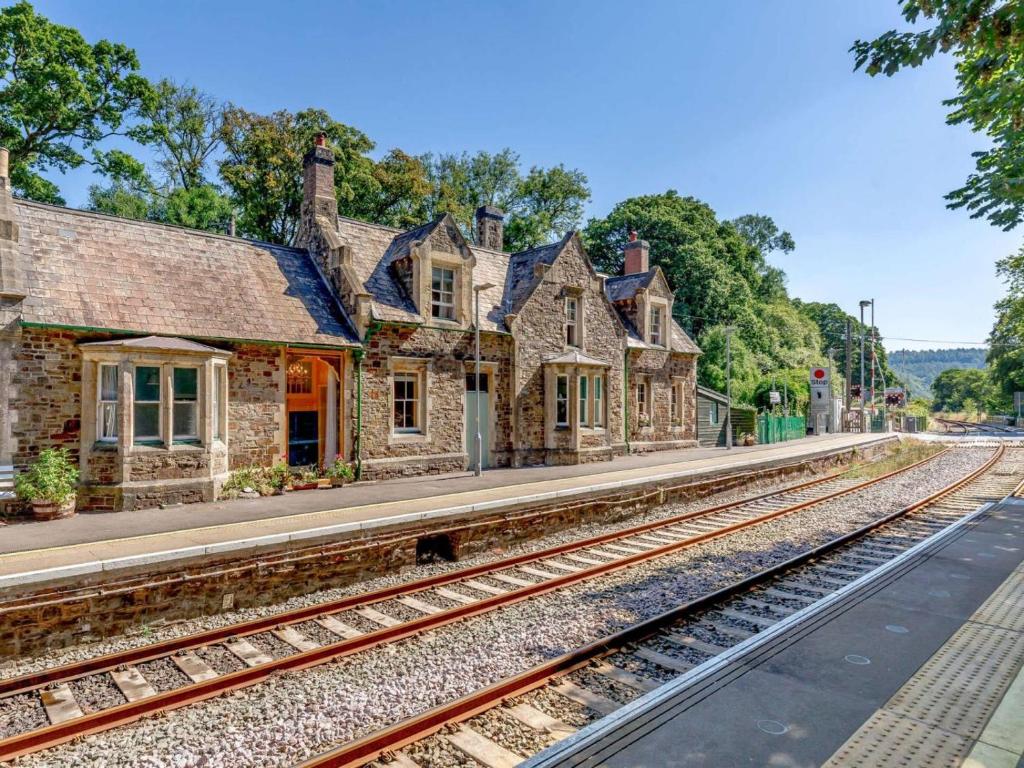 an old train station with train tracks in front of it at 1 Bed in Chulmleigh oc-88862 in Chawleigh