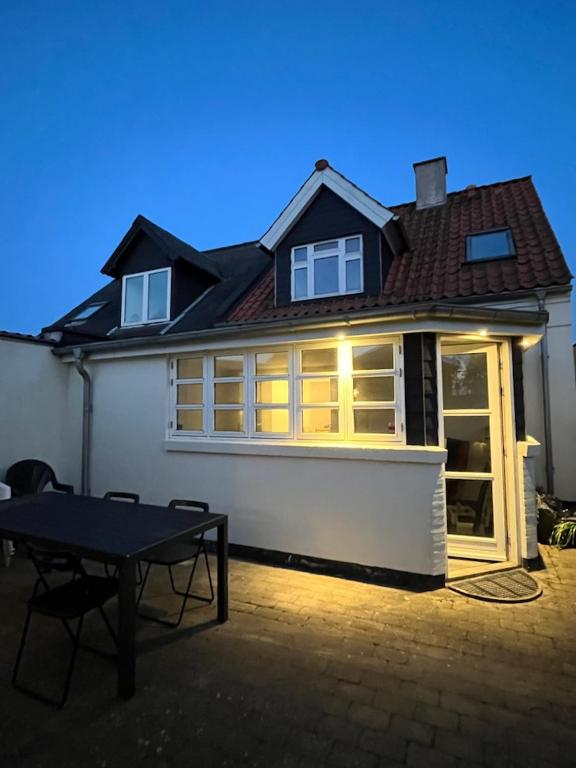 a house with a table in front of it at Møllevej in Hjørring