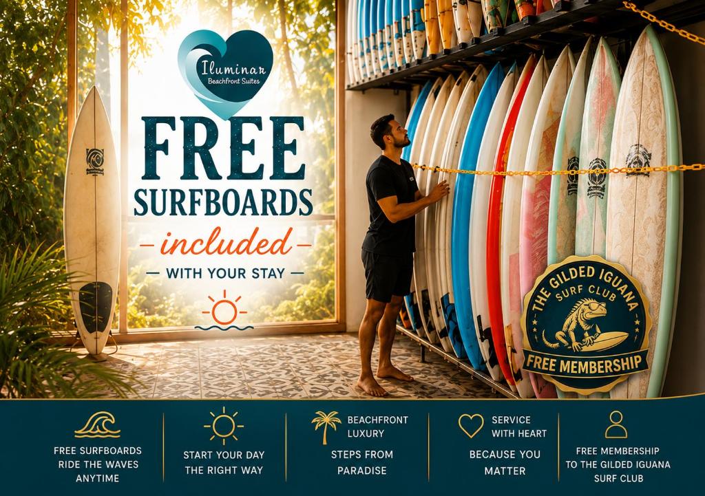 a man standing in front of a rack of surfboards at Iluminar Beachfront Suites in Nosara