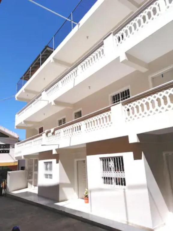 a large white building with balconies on it at Residencia Nilaya in Las Terrenas