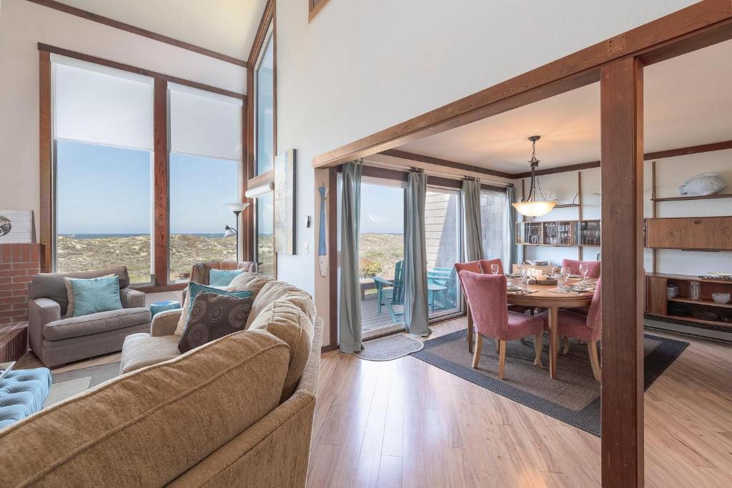 a living room with a couch and a table at 3823 Sand Dollar House in Moss Landing