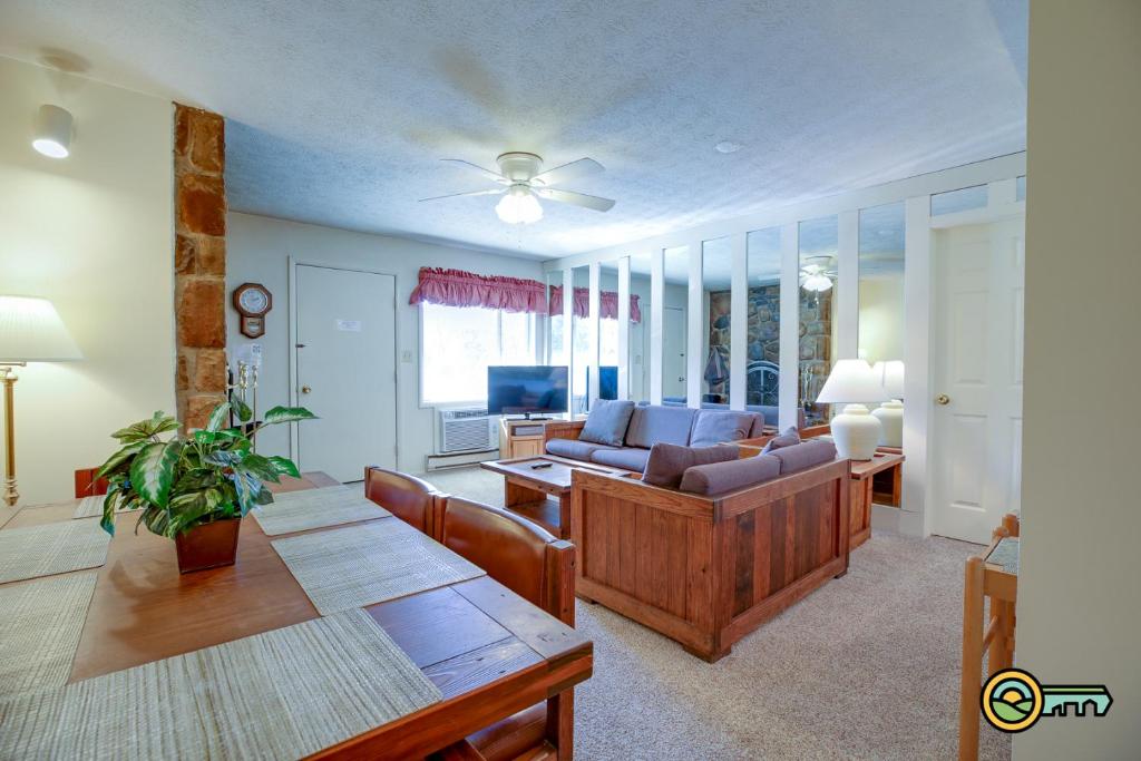 a living room with a couch and a table at Aspen East Unit #122 in Basye