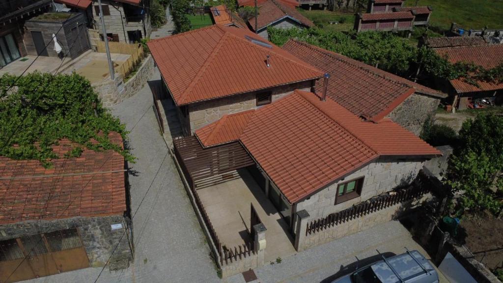an overhead view of a house with an orange roof at Cantinho da Cuca - Gerês in Terras de Bouro