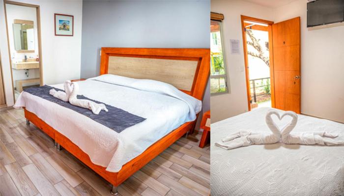 a bedroom with a bed with two swans on it at Hotel la Cuesta Toscana in Bernal