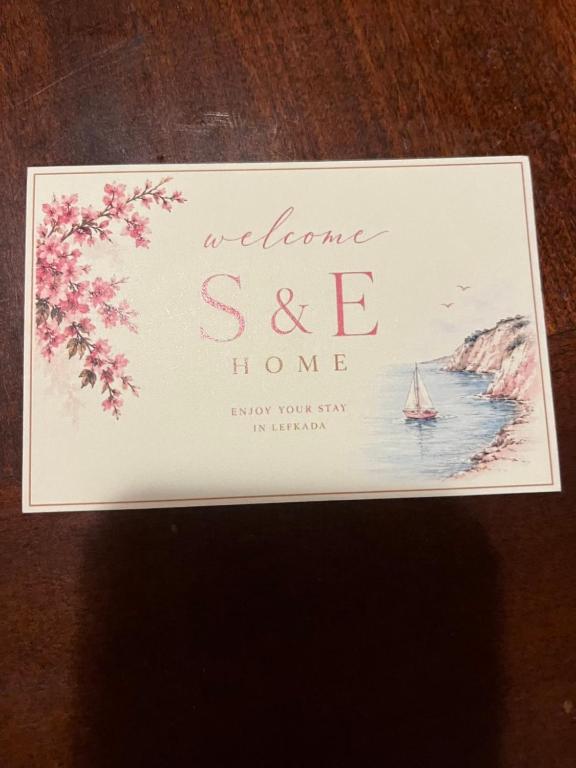 a sign that says welcome see home with a sailboat at S&E home in Nikiana