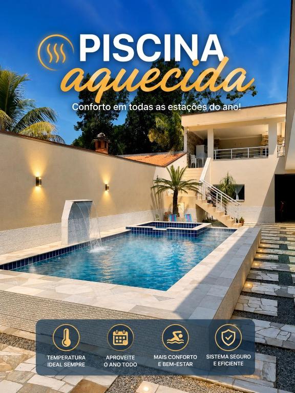 a magazine cover with a swimming pool in front of a building at Recanto da Ivete in São Sebastião