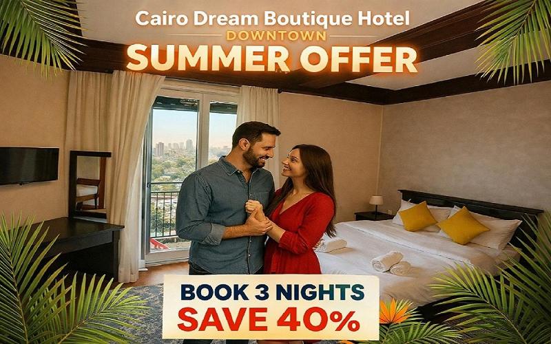 a man and a woman standing in front of a bed at Cairo Dream Boutique Hotel in Cairo