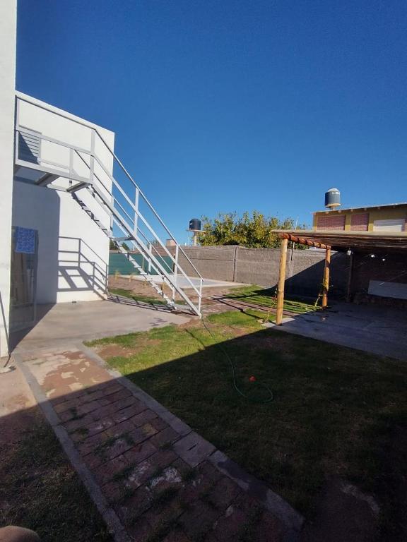 a view of a building with a staircase and a yard at Nido del Sol in Pocito