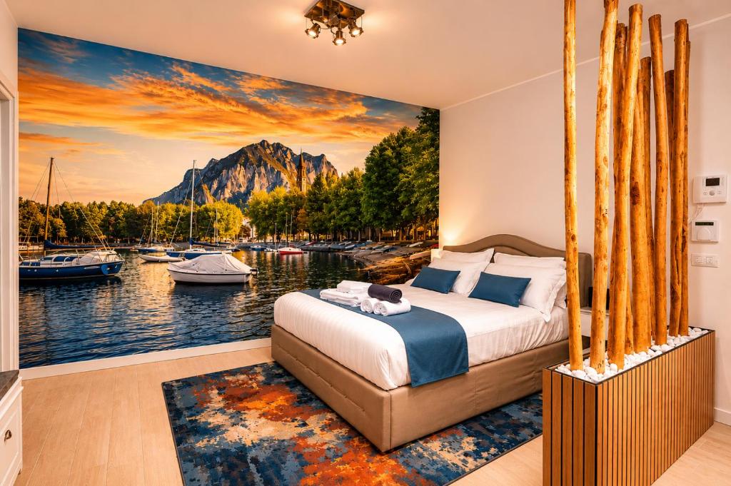 a bedroom with a view of the water and boats at 2 passi dal lago, Como Lake in Abbadia Lariana