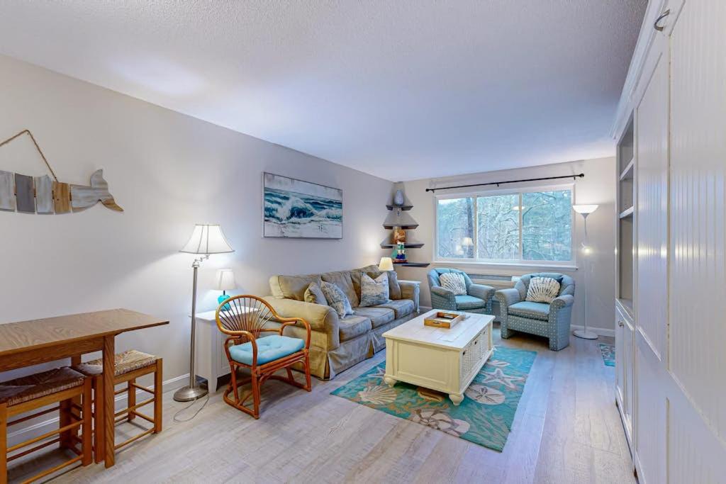 a living room with a couch and chairs and a table at The Condo at Ocean Edge in Brewster