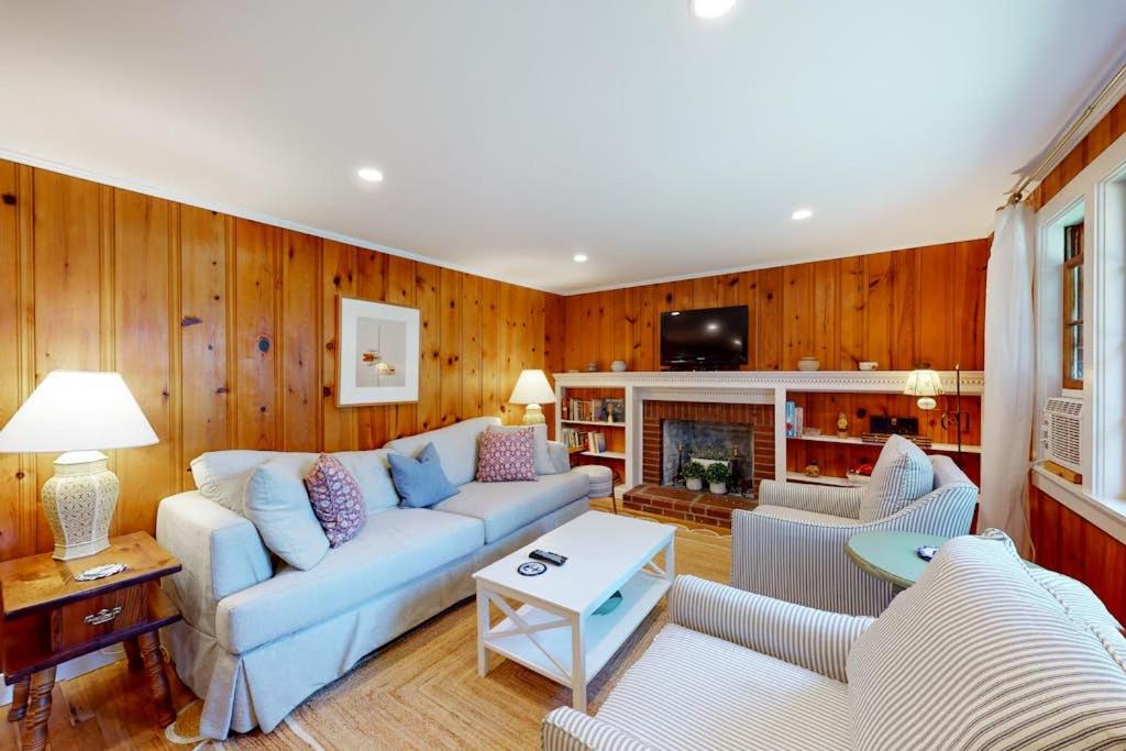a living room with a couch and a fireplace at Sweet Victory in Harwich Port