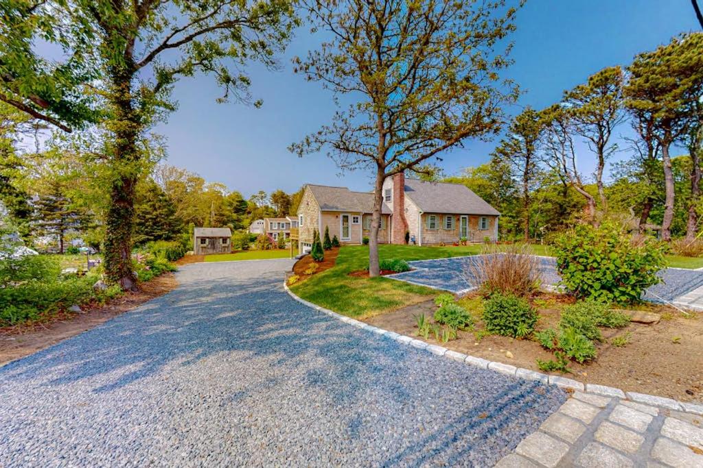 a house with a driveway in front of a house at New England Getaway in Dennis