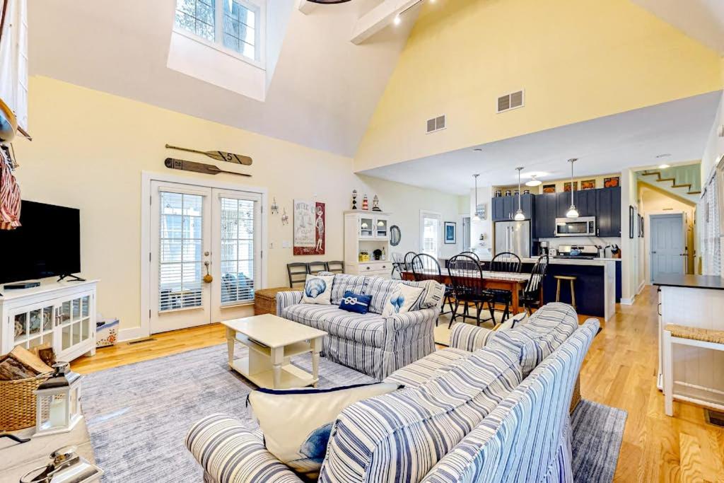 a large living room with couches and a kitchen at The Lighthouse in Lakeshore Cottages in Union Pier