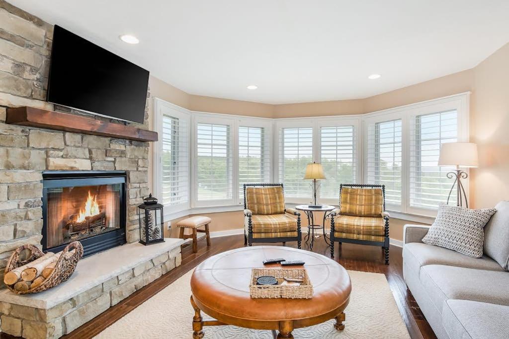 a living room with a couch and a fireplace at Mountain Top 713 in Thompsonville