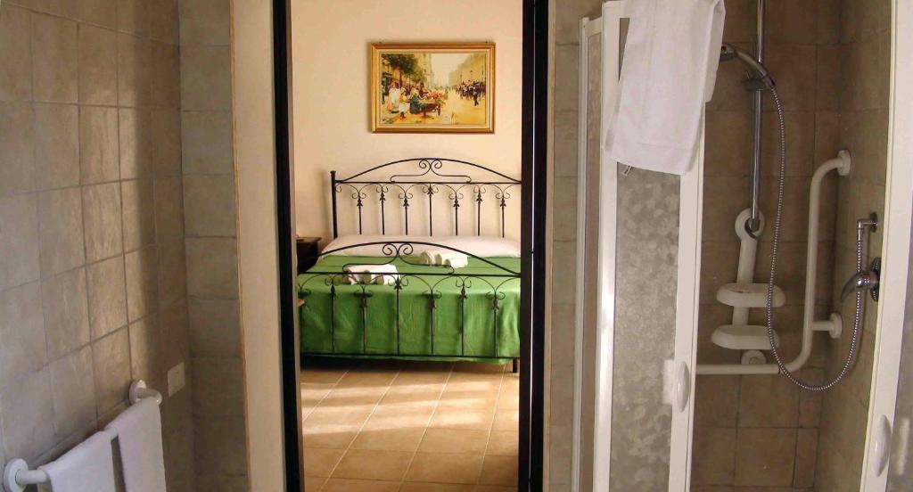 Postel nebo postele na pokoji v ubytování L'Antico Trappeto