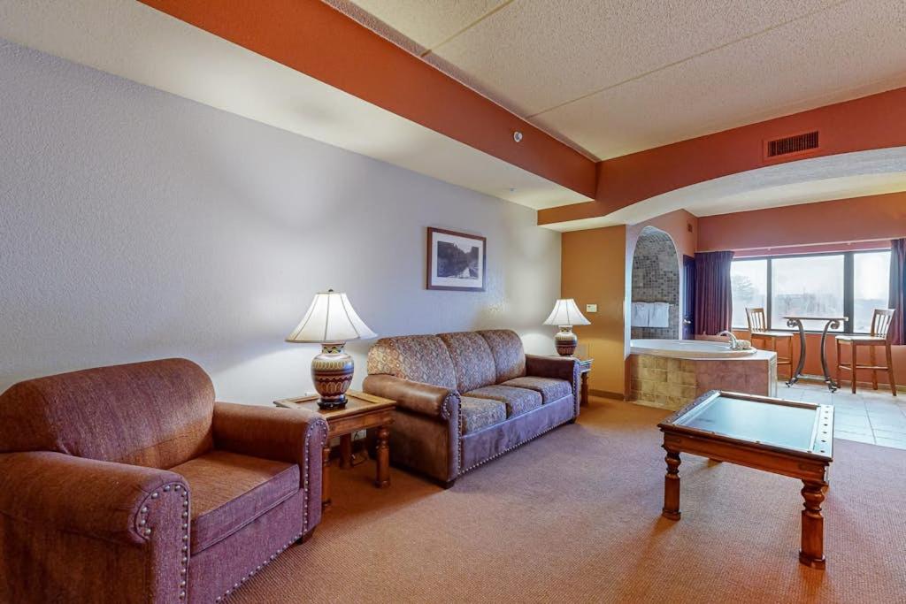 a living room with two couches and a table at Chula Vista Condo #2402 in Wisconsin Dells