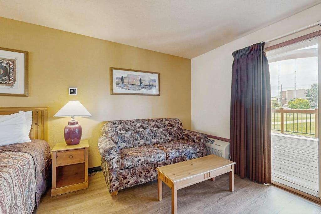 a hotel room with a bed and a couch at Chula Vista Resort Villa # 7212 in Wisconsin Dells