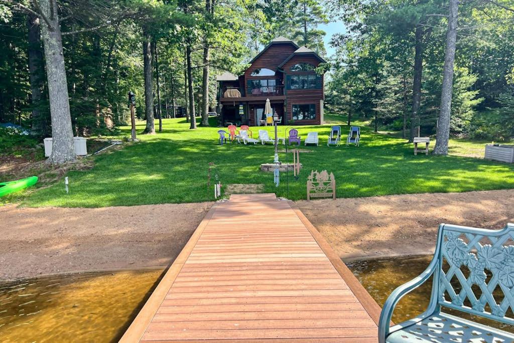 a wooden walkway leading to a house in a park at Shangri La in Eagle River