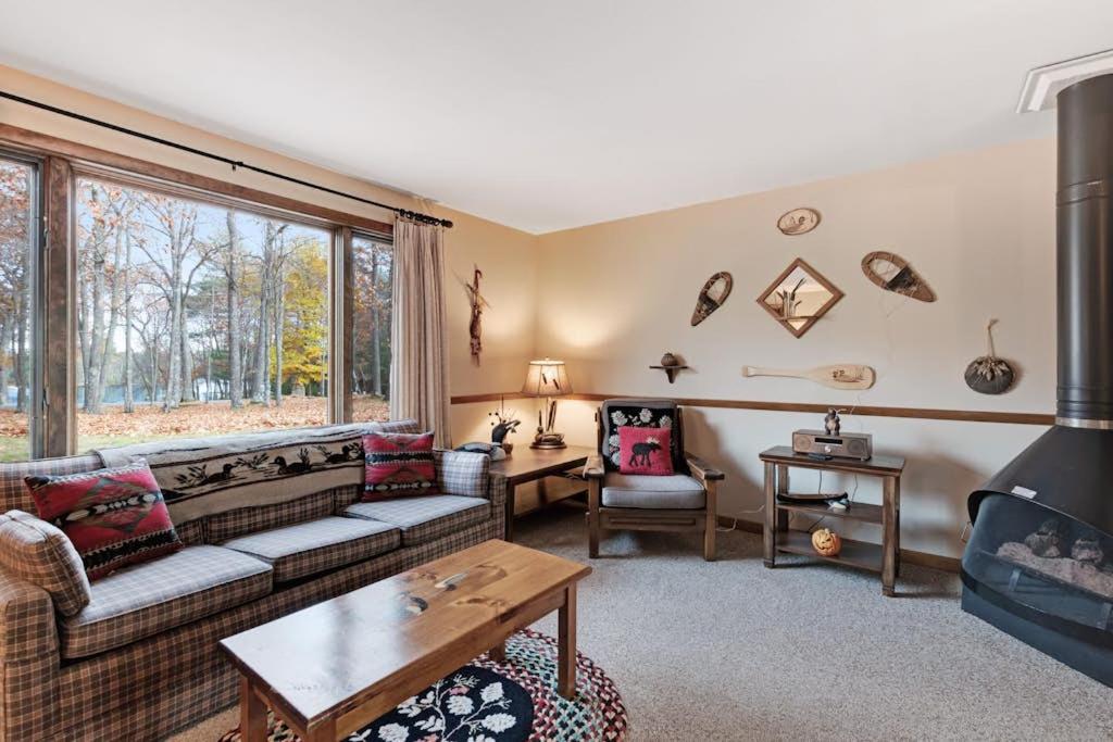 a living room with a couch and a fireplace at Cleerwood Village #261 in Eagle River