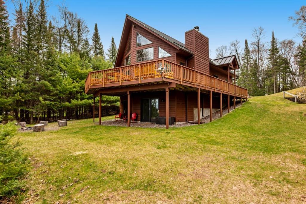 a large house with a deck on a hill at Sandy Cove in Saint Germain