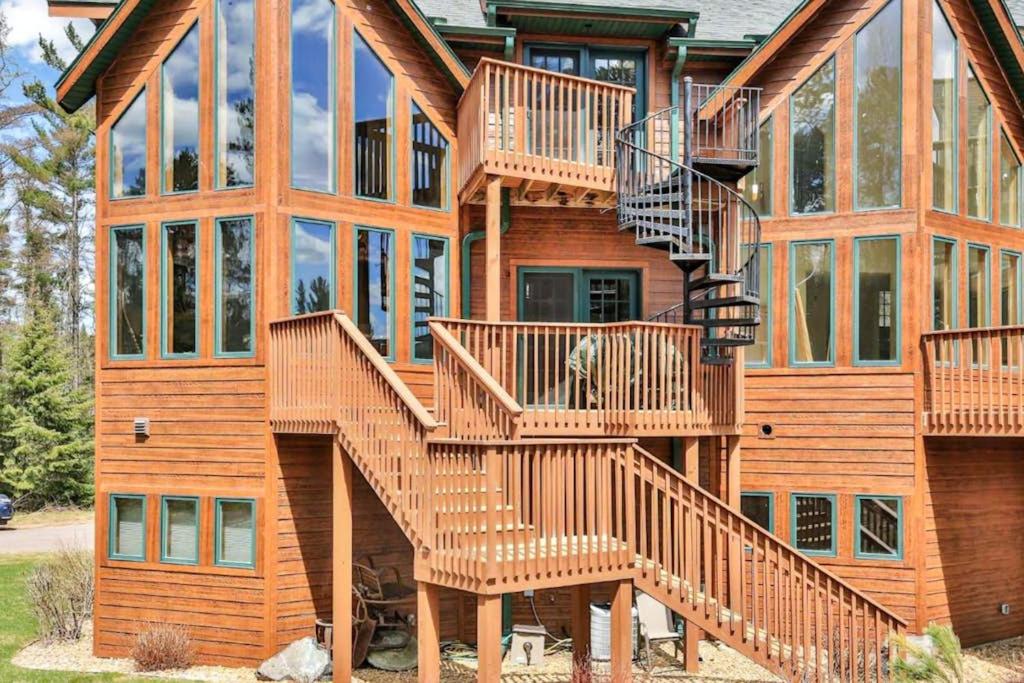 a large wooden house with stairs on it at Copperwood #1 in Eagle River