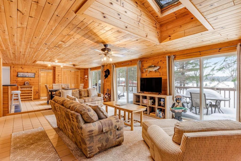 a living room with a couch and a tv at The Haven in Eagle River