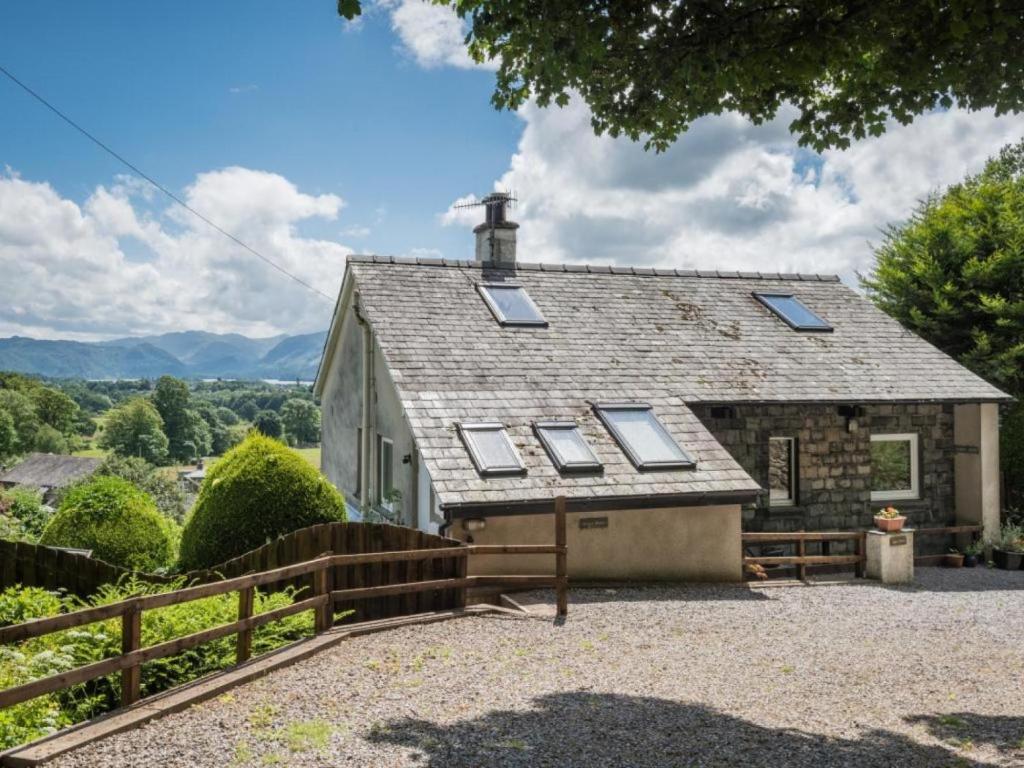 a house with a roof with windows and a fence at 3 Bed in Keswick oc-sz540 in Applethwaite