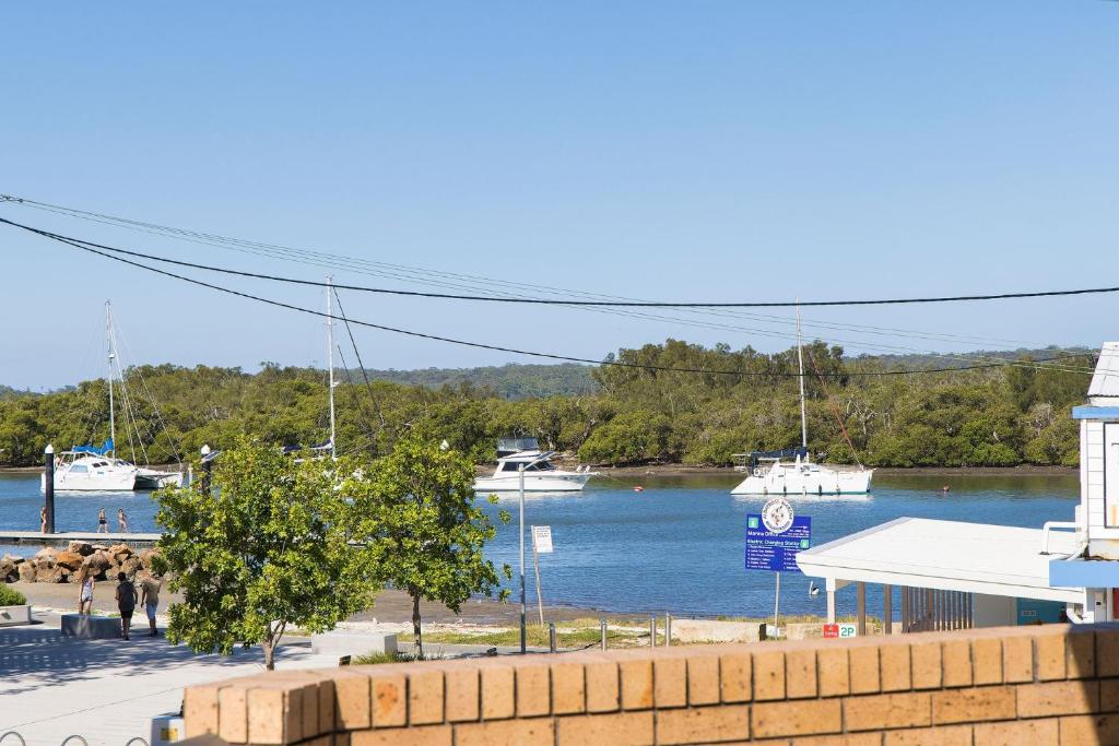 a view of a marina with boats in the water at Coastal Bliss in Lemon Tree Passage