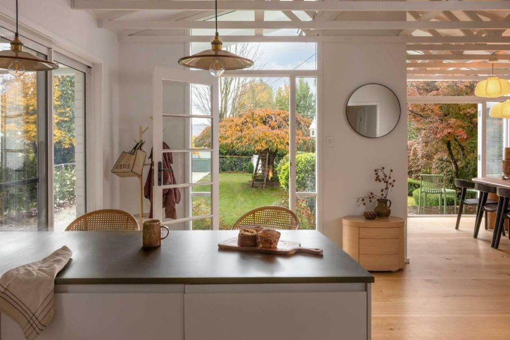 a kitchen with a counter and a large window at Wondervale in Burrawang