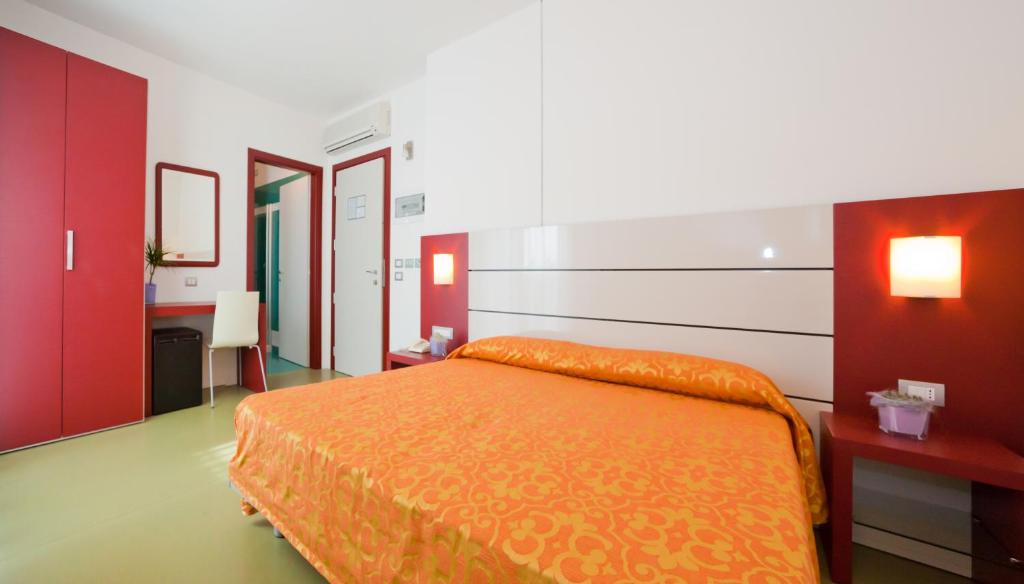 Postel nebo postele na pokoji v ubytování Hotel Raffaello