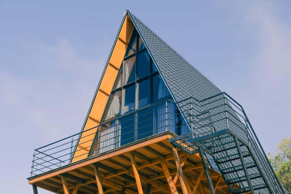 a building with a glass roof on top of it at Cabanas Monte Cristo in Serafina Corêa