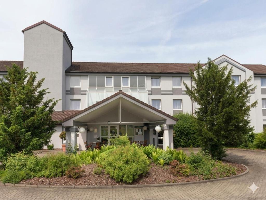 a rendering of the front of a building at Peine Salzgitter Hotel by Belvilla in Peine