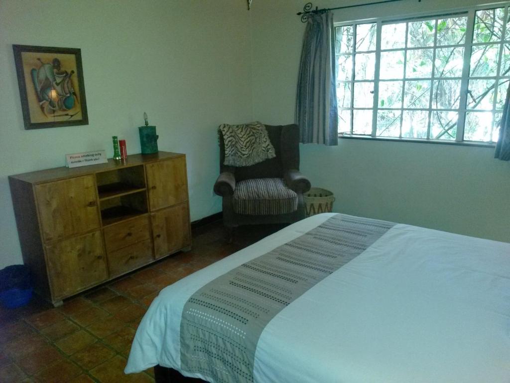 Postel nebo postele na pokoji v ubytování Mwanzo Lodge