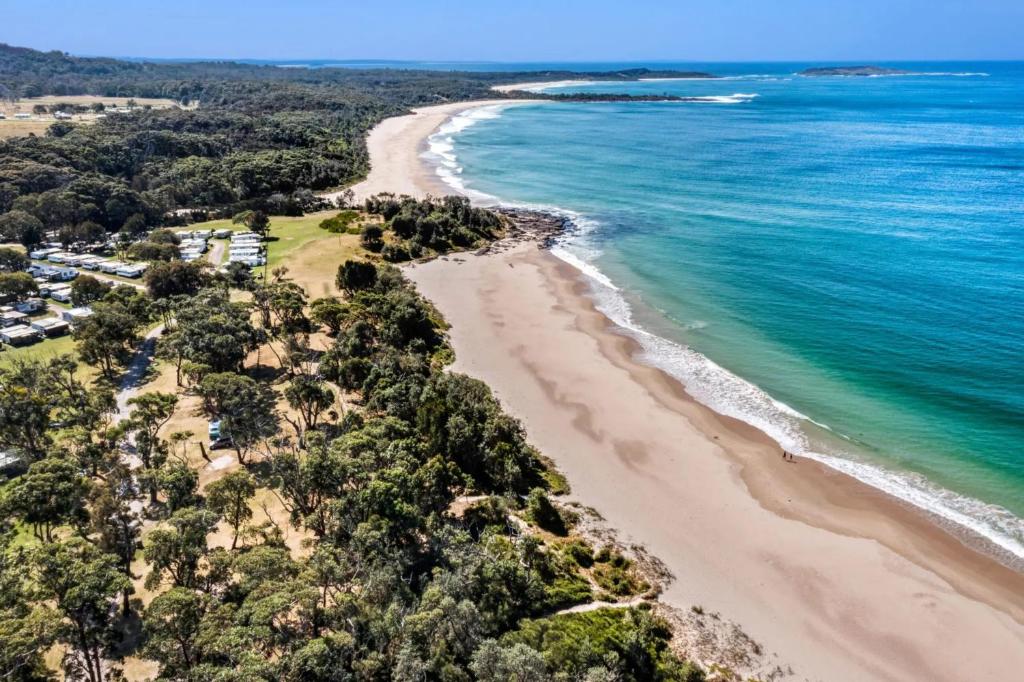 an aerial view of a beach and the ocean at Tasman Holiday Parks - Kioloa Beach in Kioloa