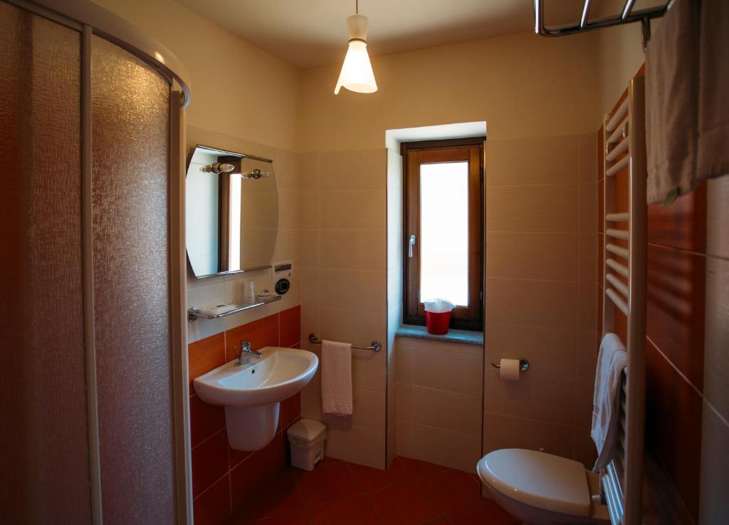 Koupelna v ubytování Albergo dei Pescatori