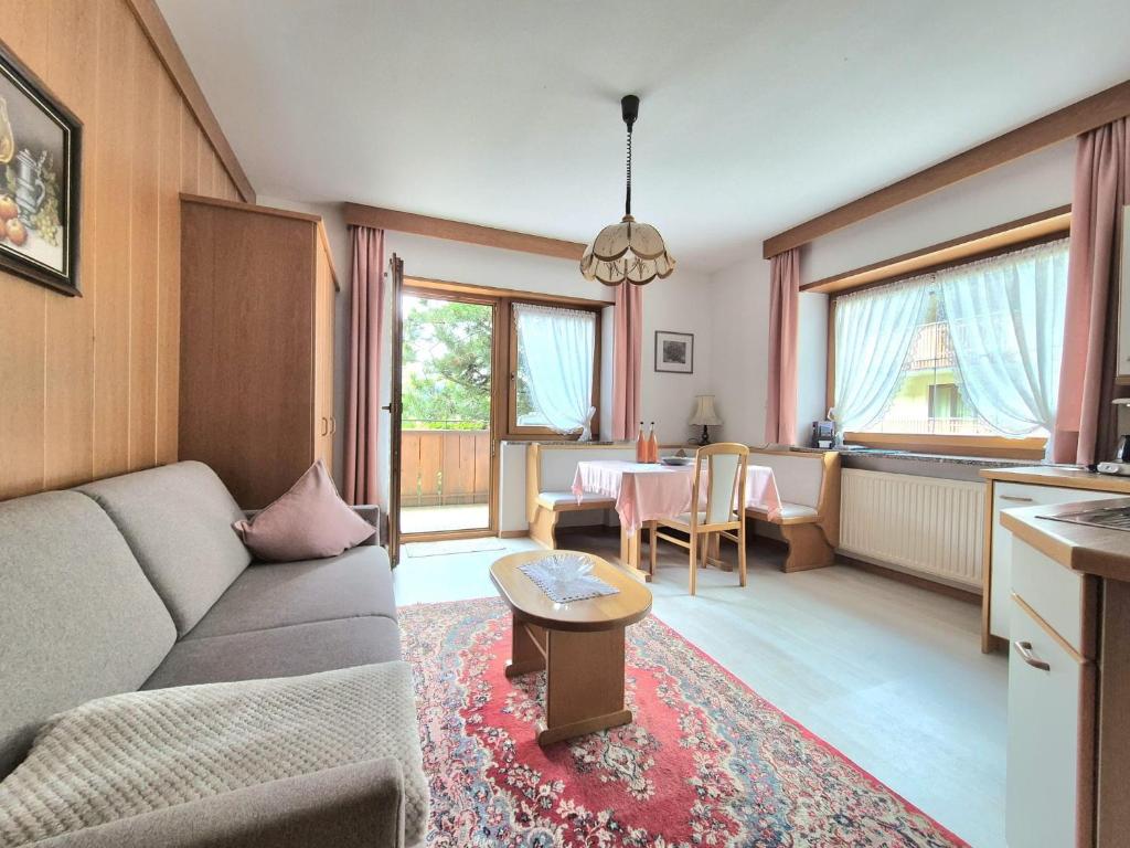 a living room with a couch and a table at Mayr Apartments Drei in Plaus