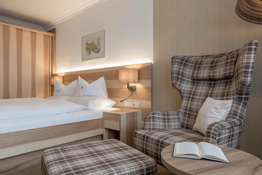 Postel nebo postele na pokoji v ubytování Hotel Madeleine