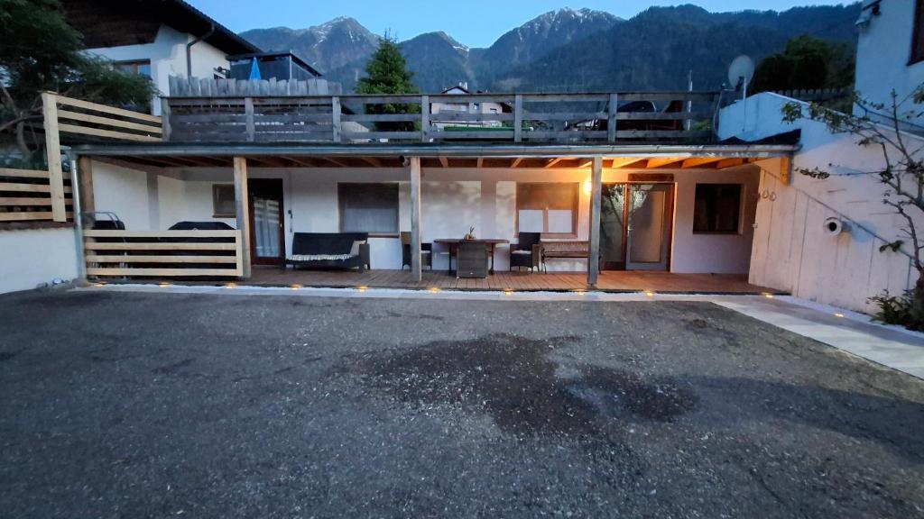 a house with a large parking lot in front of it at apartment harmony in Sautens
