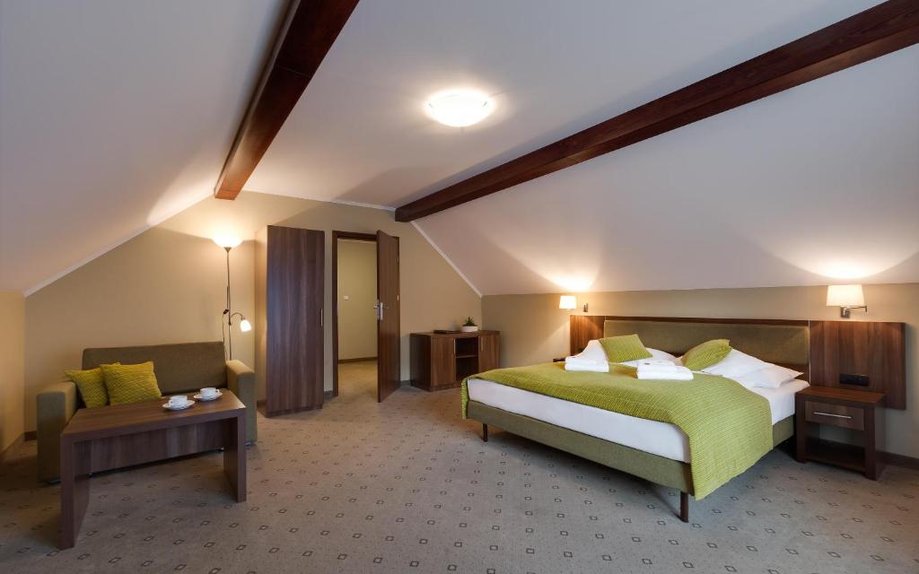 Postel nebo postele na pokoji v ubytování Artus Resort