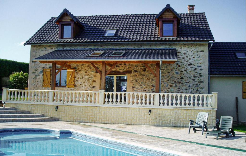 a house with a pool in front of it at Ancienne Forge Avec Piscine in Saint-Mesmin