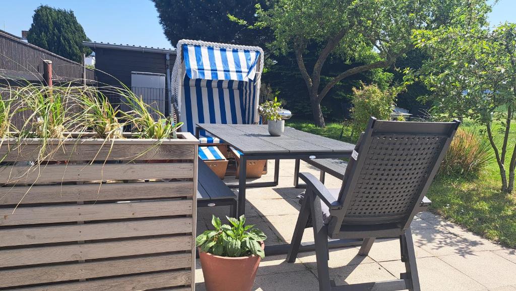 a table and two chairs on a patio at Meerferienwohnungen Kühlungsborn in Kühlungsborn