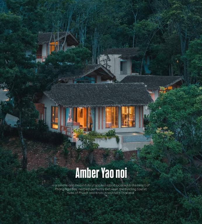 a house with its lights on in front of it at Amber Yao Noi in Ko Yao Noi