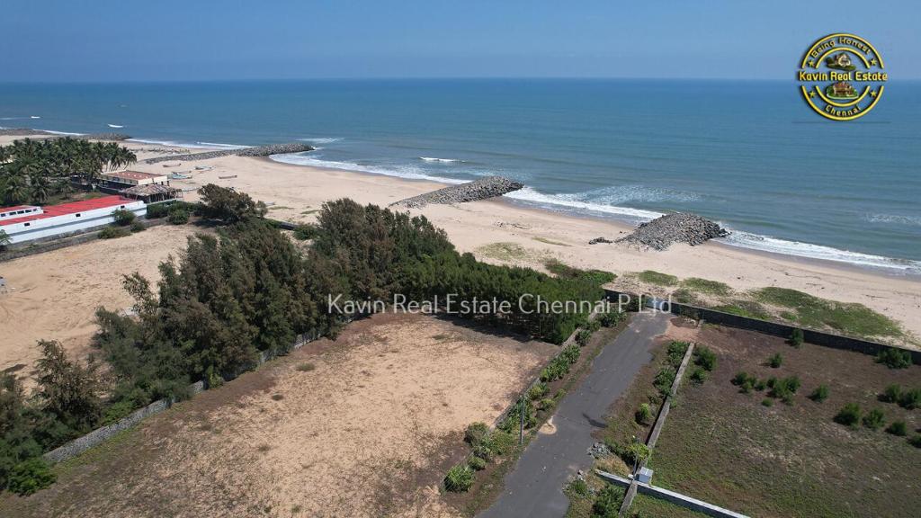 an overhead view of a beach with the ocean at Koovathur Ecr beach house in Kūvattūr