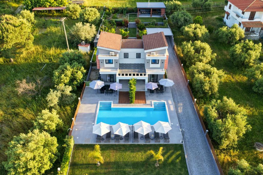 an aerial view of a house with a swimming pool at Assos Luxury Villas in Pefkochori