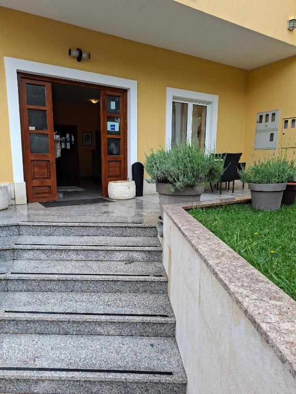 a house with stairs leading to a door at Studio Apartman Rovinj in Rovinj