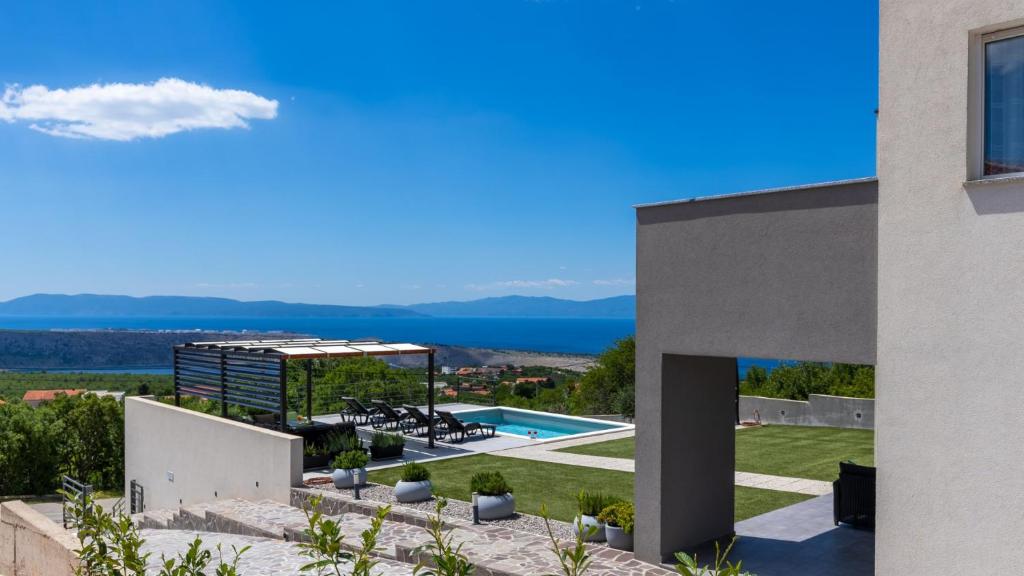 a view of a house with a swimming pool at Villa Luminosa by Villas Guide in Kraljevica