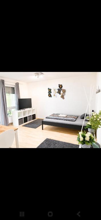 a living room with a couch and a table at Ulmer Nestchen in Ulm